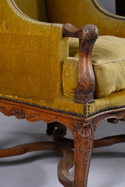 Large natural walnut wing chair, 
carved...
