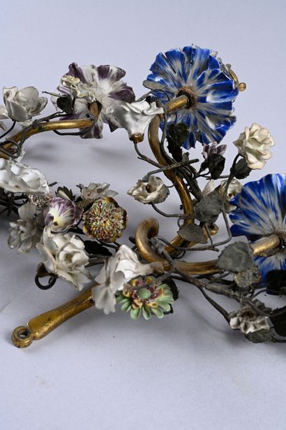 Pair of iron and gilt bronze sconces with...