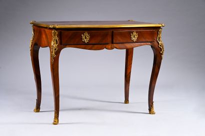 Mahogany veneered writing table, with a curved...