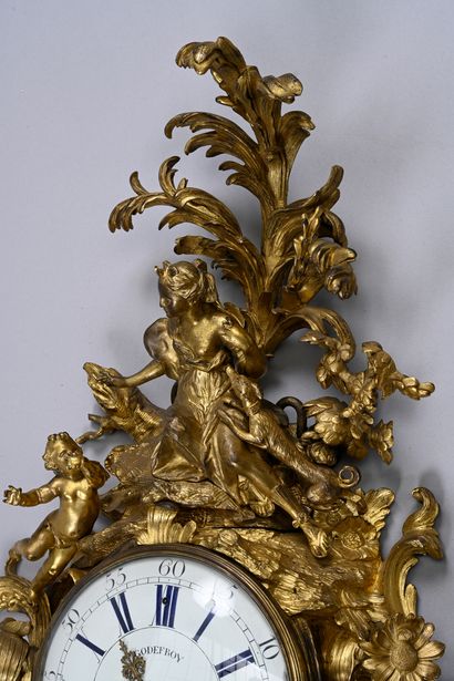 Large ormolu cartel and barometer with asymmetrical...