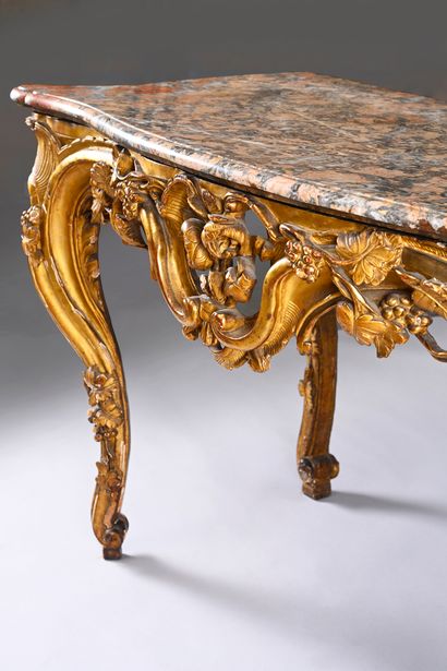 Carved, molded and gilded wood console 
and...