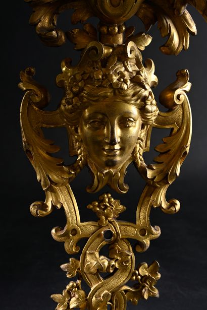 Pair of asymmetrical two-light sconces 
in...