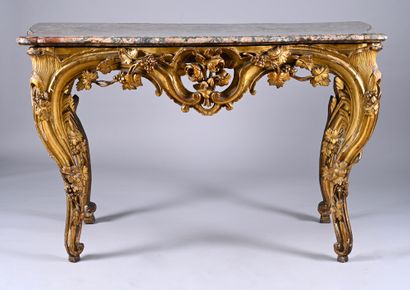 Carved, molded and gilded wood console 
and...