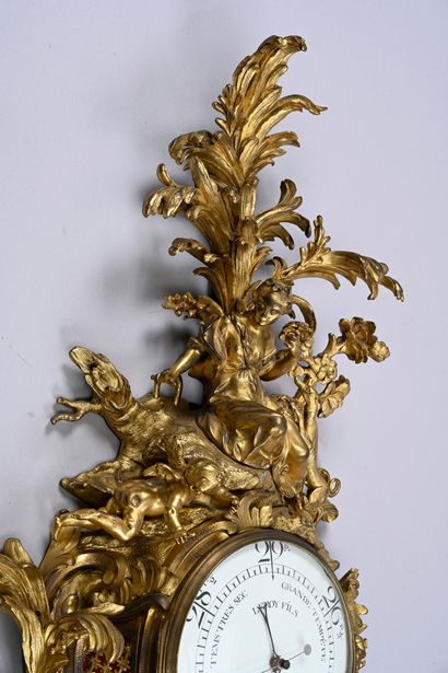 Large ormolu cartel and barometer with asymmetrical...