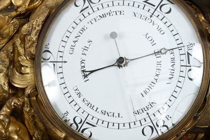 Large ormolu cartel and barometer with asymmetrical...