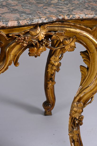 Carved, molded and gilded wood console 
and...