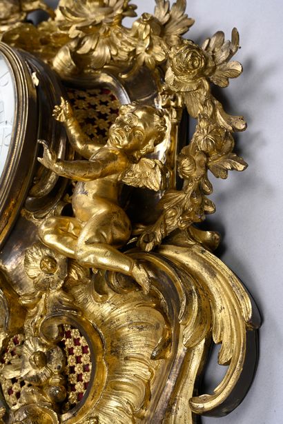 Large ormolu cartel and barometer with asymmetrical...