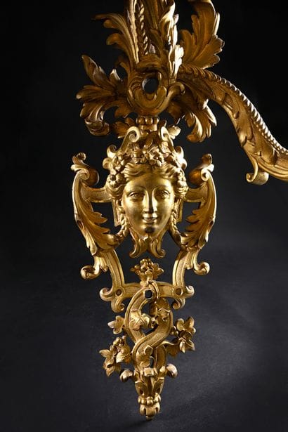 Pair of asymmetrical two-light sconces 
in...