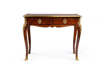 Mahogany veneered writing table, with a curved...