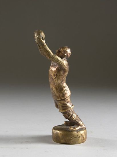 Mascotte en bronze doré. Signée Guésadez...