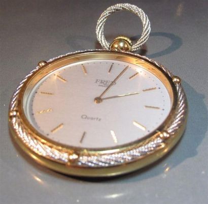 FRED
Montre de poche en plaqué or et câble...