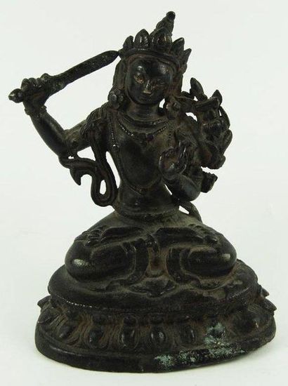 Bodhisattva Manjuçrî assis en padmâsana sur...