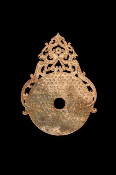 Disque «Bi» à décor ajouré de phénix.En jade...