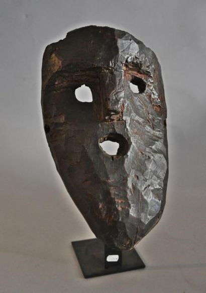 Masque chamanique, figurant une tête d'homme.En...