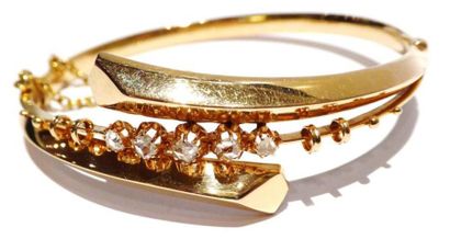 BRACELET JONC en or 18K (750/°°) serti d’une...