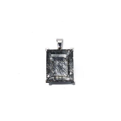 PENDENTIF en or gris 18k (750/°°), retenant...