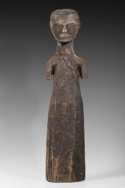 Statuette en bois sculpté, le vêtement en...