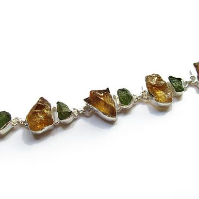 BRACELET articulé en argent (925/°°), ornée...