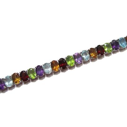 BRACELET articulé en argent (925/°°), orné...