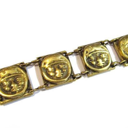 M. BUFFET. BRACELET articulé en bronze doré,...
