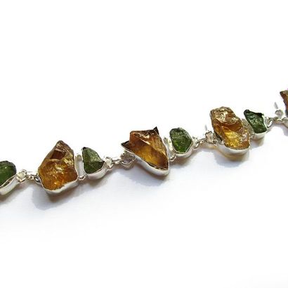 BRACELET articulé en argent (925/°°), ornée...