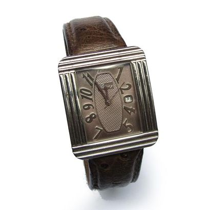 POIRAY. MONTRE BRACELET en acier. Boîtier...