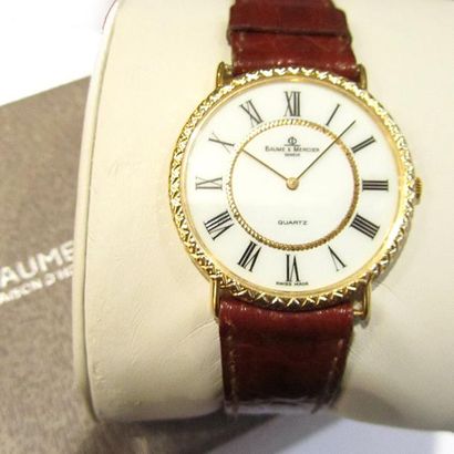 BAUME ET MERCIER. MONTRE BRACELET en or jaune...