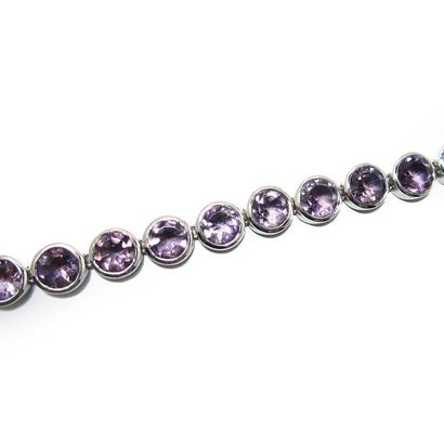 BRACELET articulé en argent (925/°°), orné...