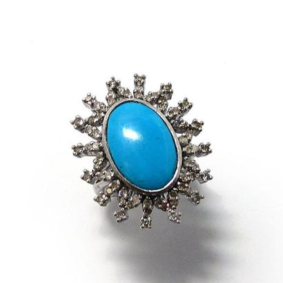 BAGUE fleur en argent (925/°°), ornée d'une...