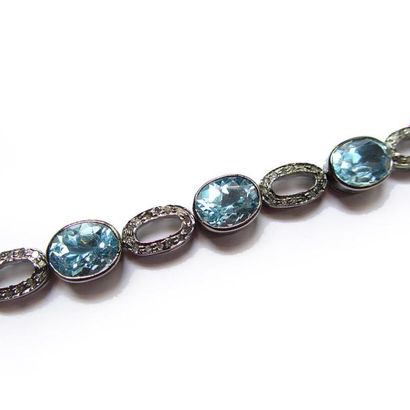 BRACELET articulé en argent (925/°°), orné...