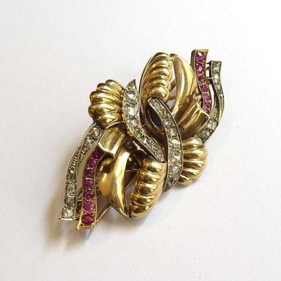 BROCHE double clip en or jaune et or blanc...