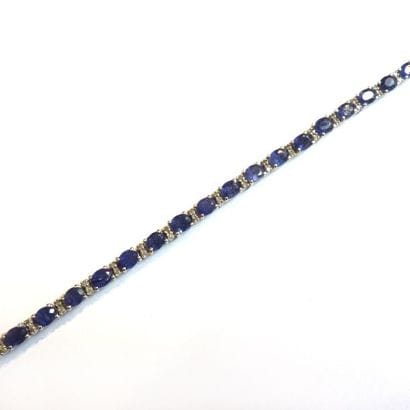 BRACELET articulé en argent (925°/°°), orné...