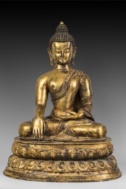 Statuette de Bouddha en bronze doré assis...