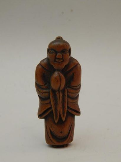 Netsuke en buis représentant un personnage...