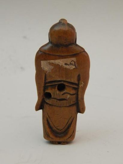Netsuke en buis représentant un personnage...