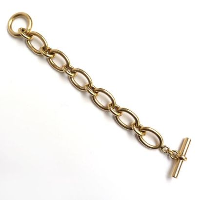 BRACELET en or jaune 18K (750/°°) articulé...