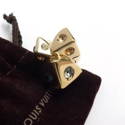 LOUIS VUITTON. Bague en métal doré, sertie...