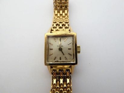 BRACELET MONTRE OMEGA en or jaune 18K (750/°°)...