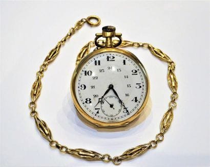 MONTRE A GOUSSET en or jaune 18K (750/°°)...
