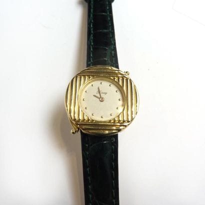 POIRAY. Montre de dame en or jaune 18K (750°/°°)...