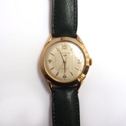 LIP. MONTRE chronomètre en or 18K (750/°°)....