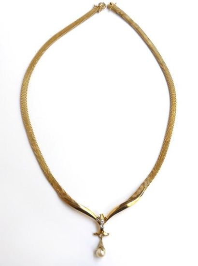 COLLIER semi-rigide en or jaune 18K (750°/°°)...