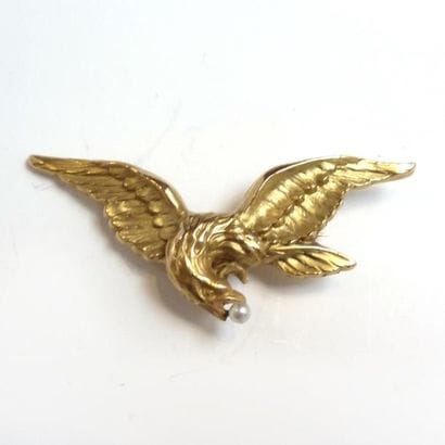 BROCHE en or jaune 18K (750°/°°) figurant...