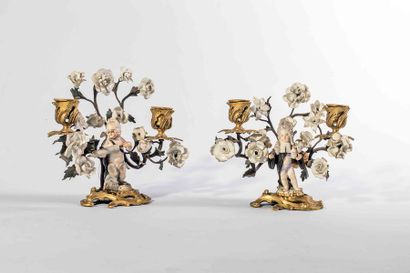 Deux candélabres en bronze doré et porcelaine...