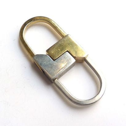 LANCEL. Porté-clé en métal doré et argen...