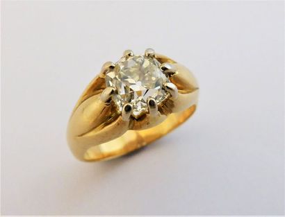 BAGUE JONC en or 18K (750/°°) ornée d’un...