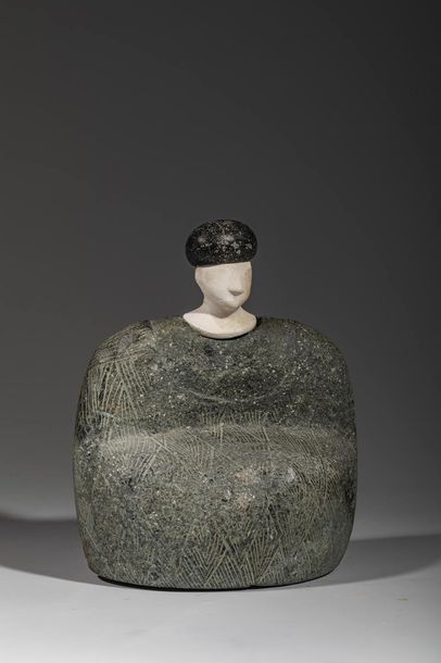 Statuette composite. 

Le personnage est...