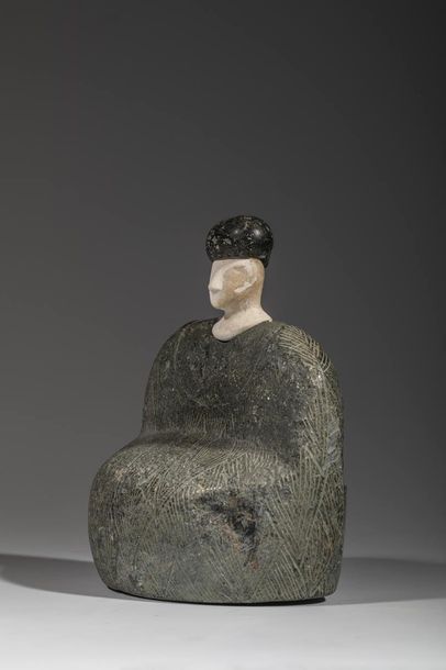 Statuette composite. 

Le personnage est...