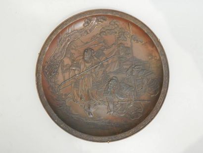Assiette en bronze, à décor de samouraïs....