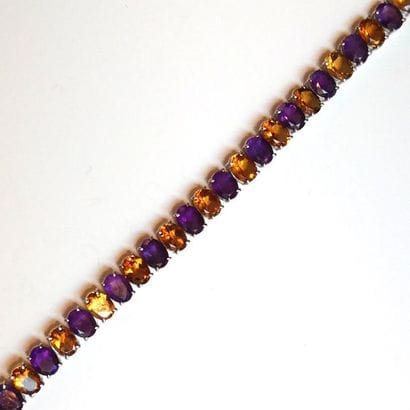 BRACELET articulé en argent (925/°°), orné...